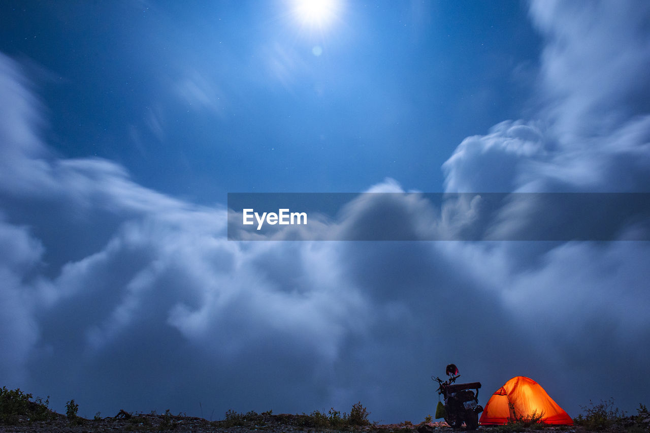 LOW ANGLE VIEW OF CLOUDY SKY OVER TOWN