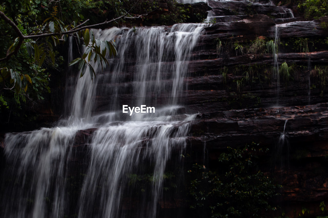 waterfall, water, beauty in nature, scenics - nature, motion, forest, nature, body of water, tree, environment, land, plant, long exposure, watercourse, no people, rock, water feature, flowing water, outdoors, blurred motion, stream, rainforest, travel destinations, non-urban scene, landscape, flowing, tourism, idyllic