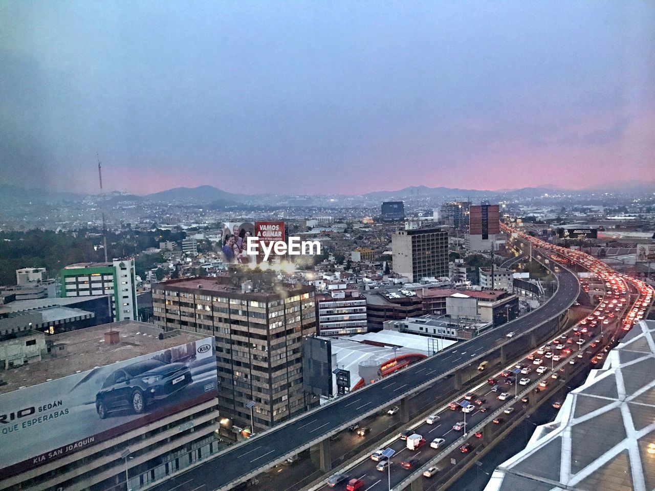 HIGH ANGLE VIEW OF CITY AGAINST SKY