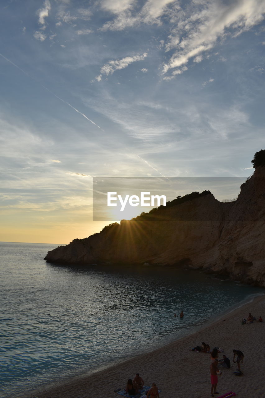 sky, nature, cloud, sunlight, beauty in nature, scenics - nature, land, rock, reflection, environment, travel destinations, outdoors, sun, travel, panoramic, no people, light, tranquility, water, landscape, day, sunset, non-urban scene, sunbeam