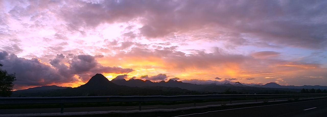 PANORAMIC VIEW OF MOUNTAINS AGAINST SKY AT SUNSET