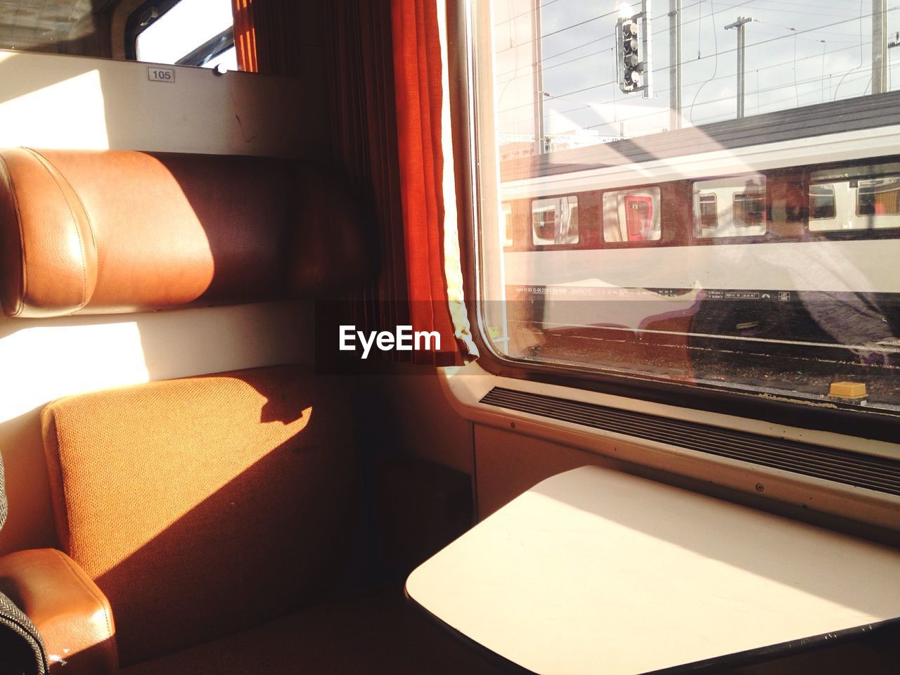 Close-up of seat by window in train