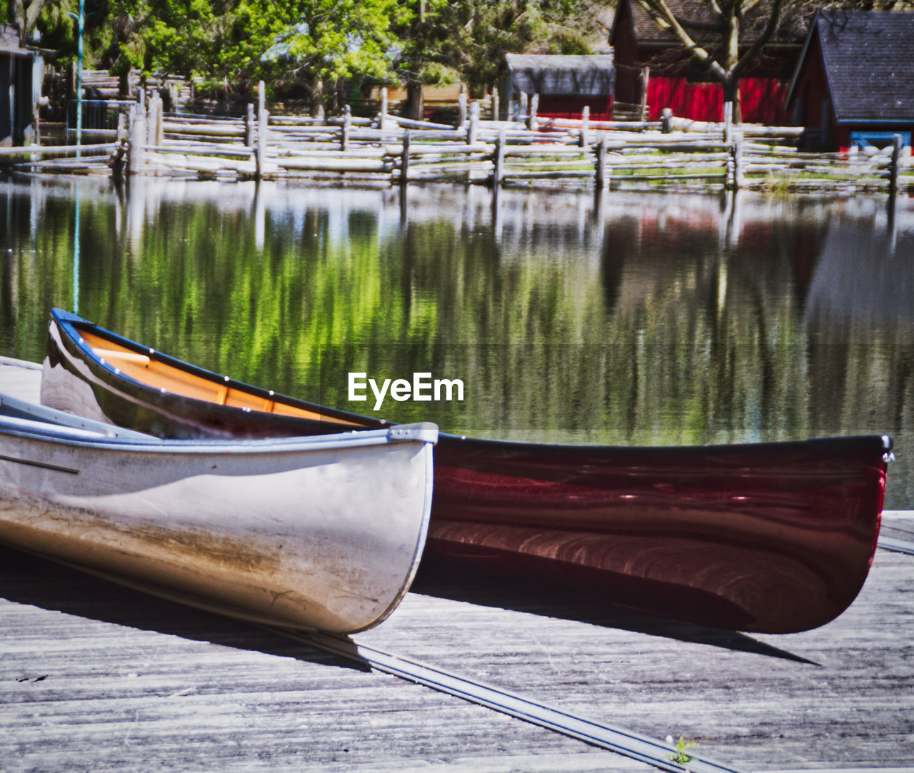 BOATS MOORED ON LAKE