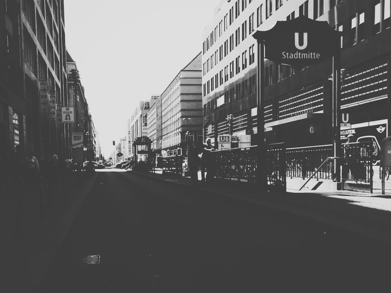 Street amidst buildings against clear sky