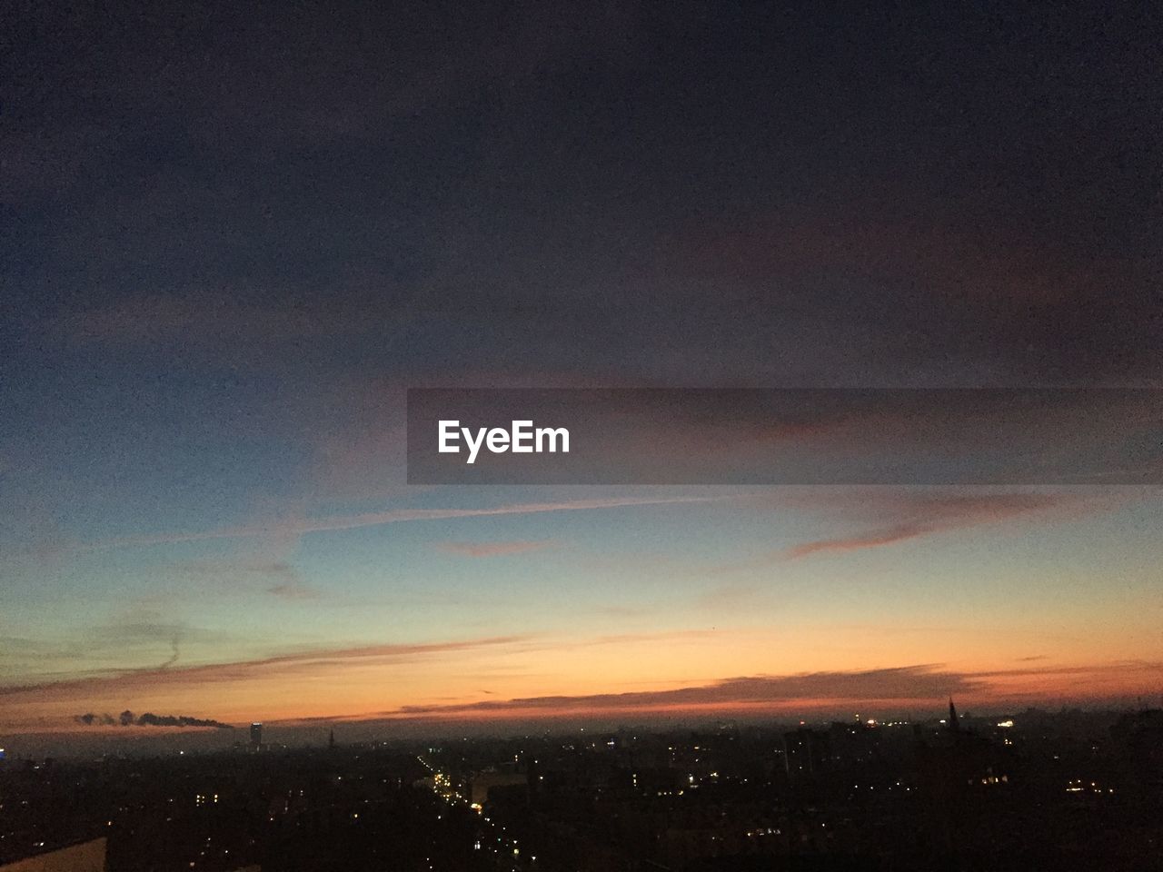 AERIAL VIEW OF LANDSCAPE AGAINST SKY AT SUNSET