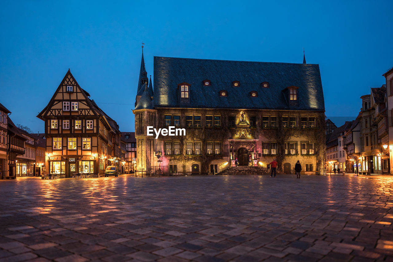 VIEW OF ILLUMINATED BUILDINGS AT NIGHT