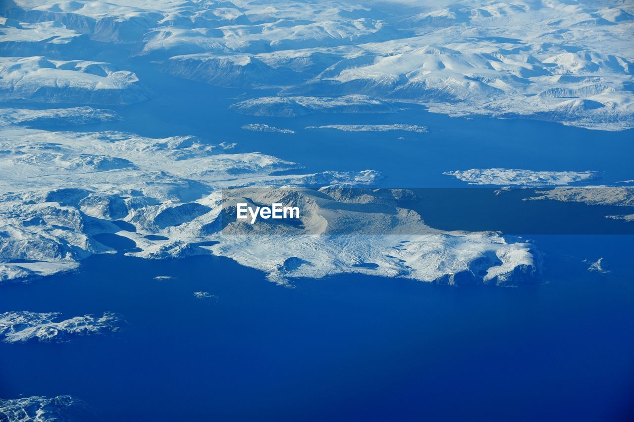 AERIAL VIEW OF SNOWCAPPED MOUNTAINS