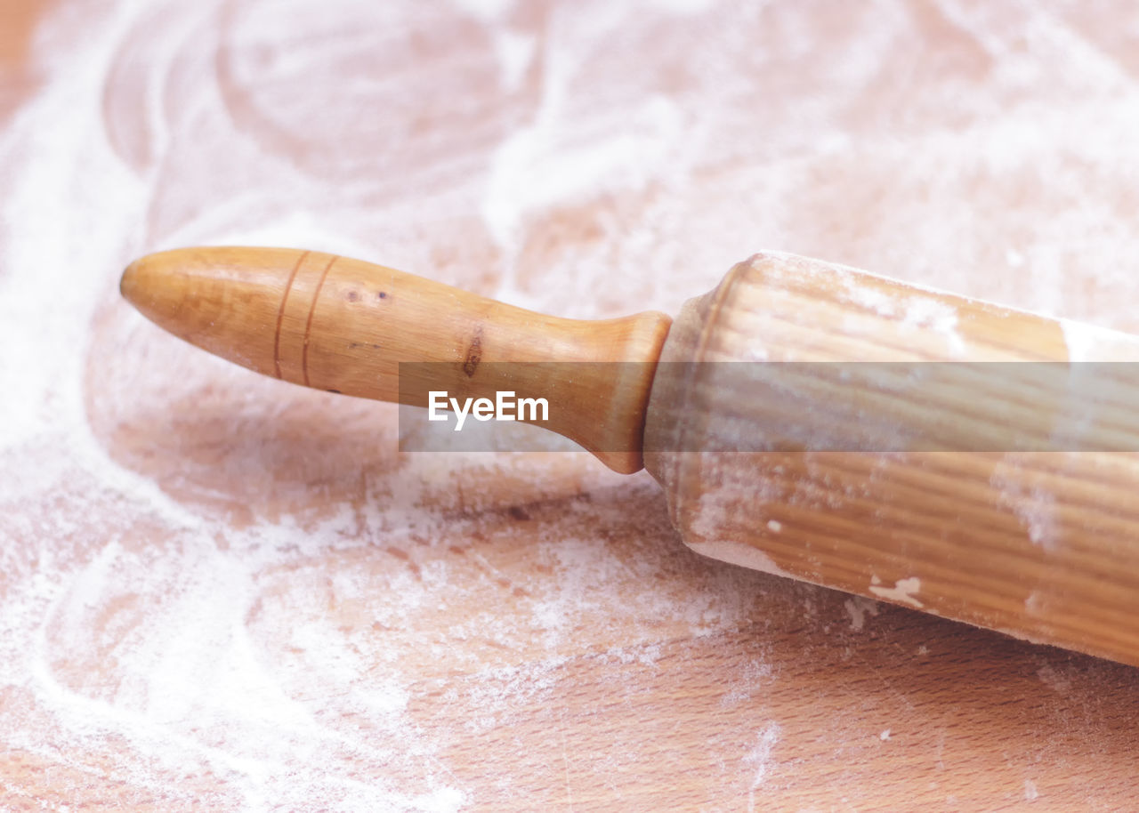 Close-up of rolling pin on table