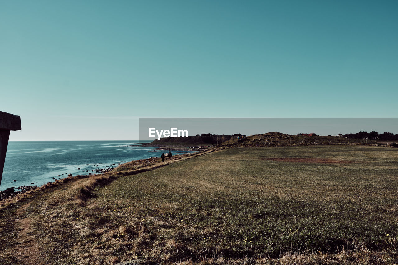 Scenic view of sea against clear blue sky