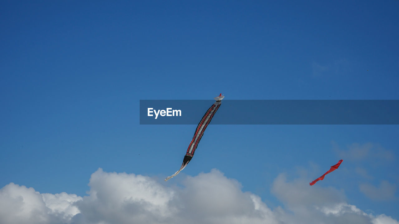 Low angle view of airplane flying in sky