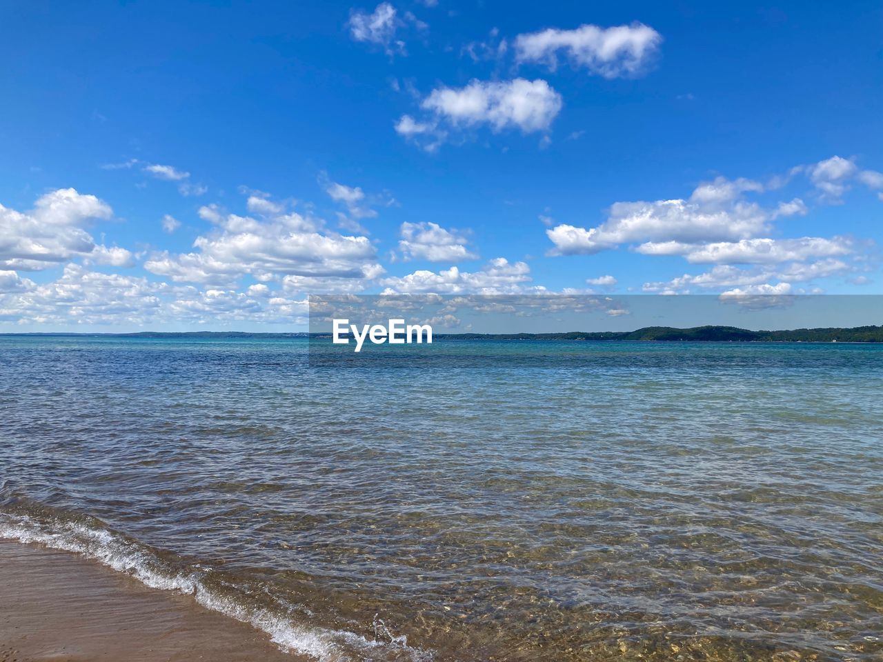 scenic view of sea against blue sky