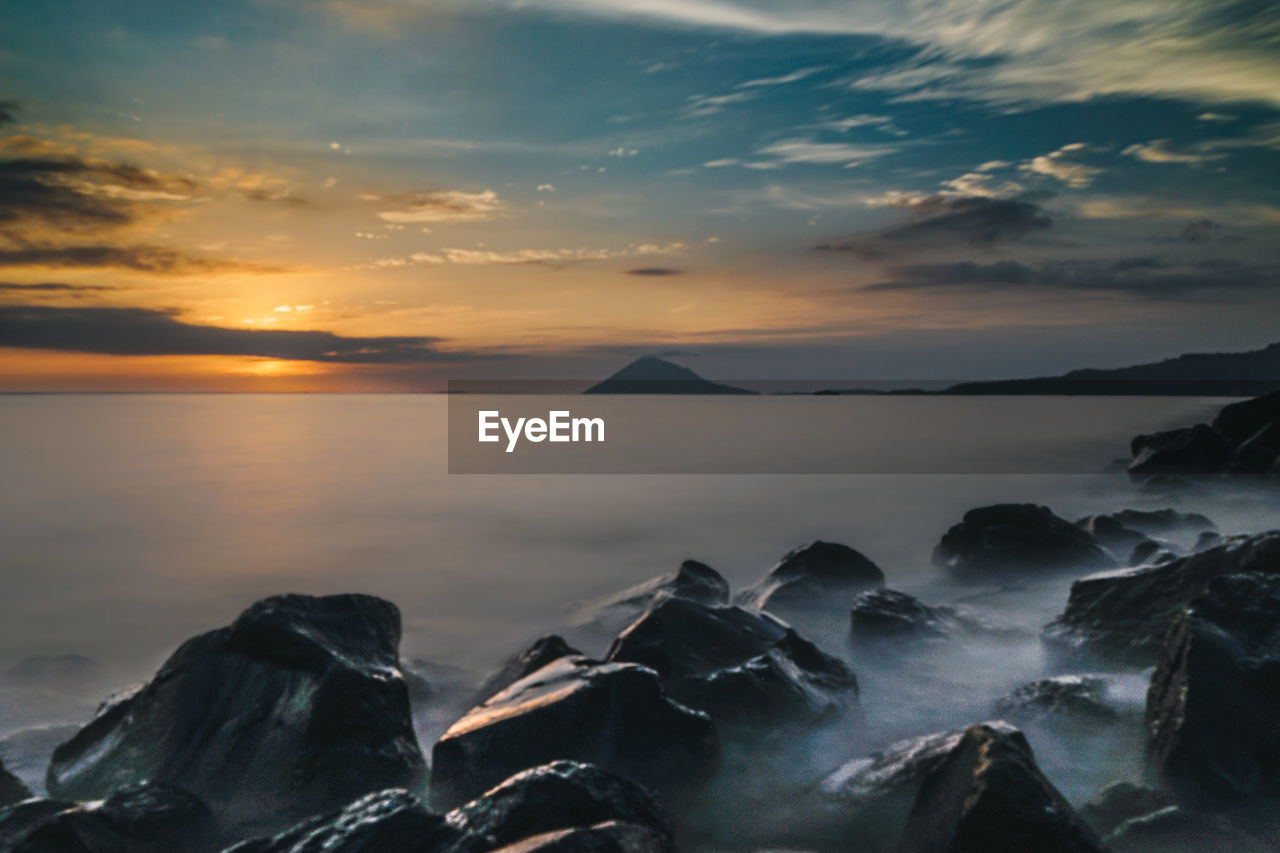 Scenic view of sea against sky during sunset