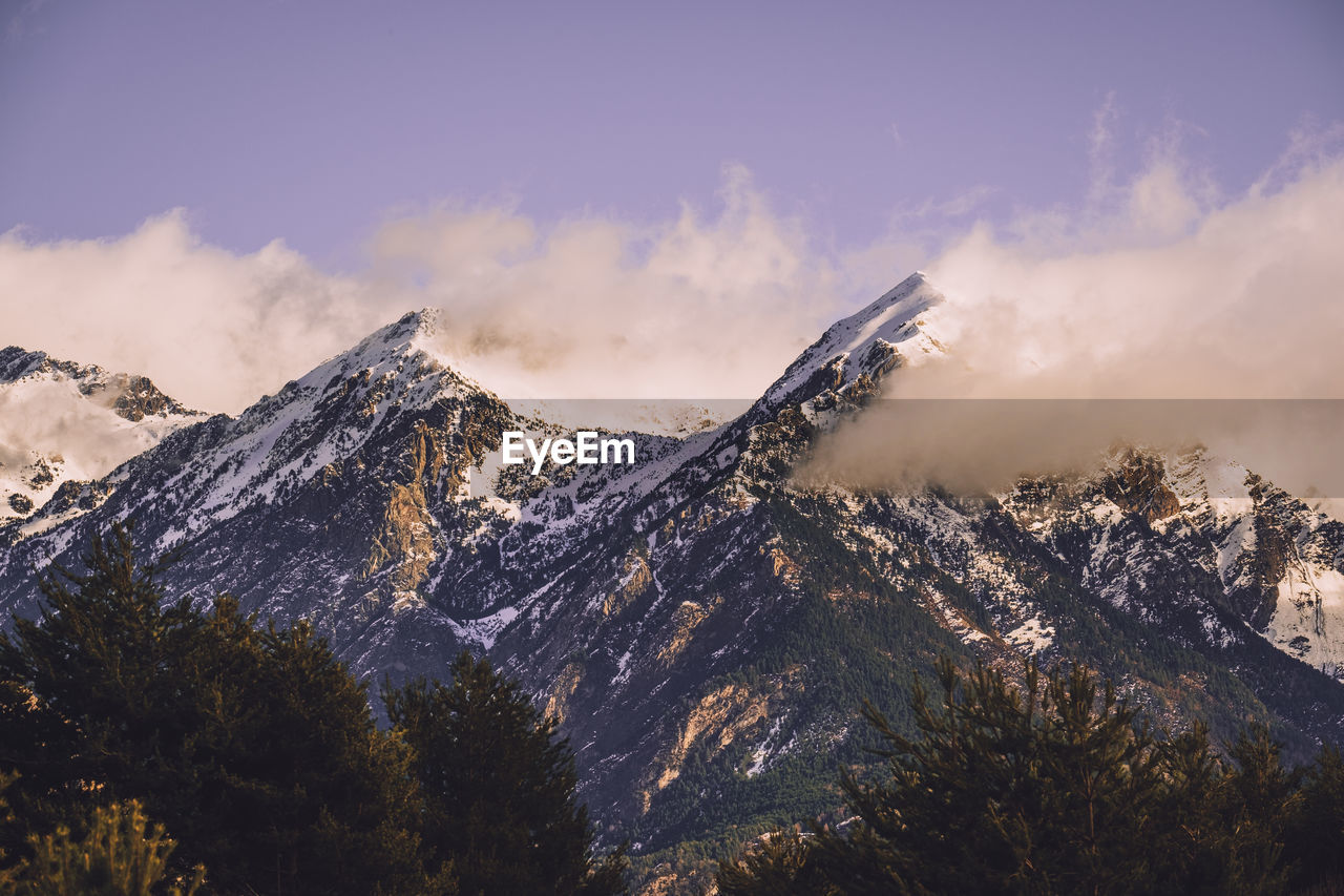 Scenic view of snowcapped mountain against cloudy sky in the pyrenees