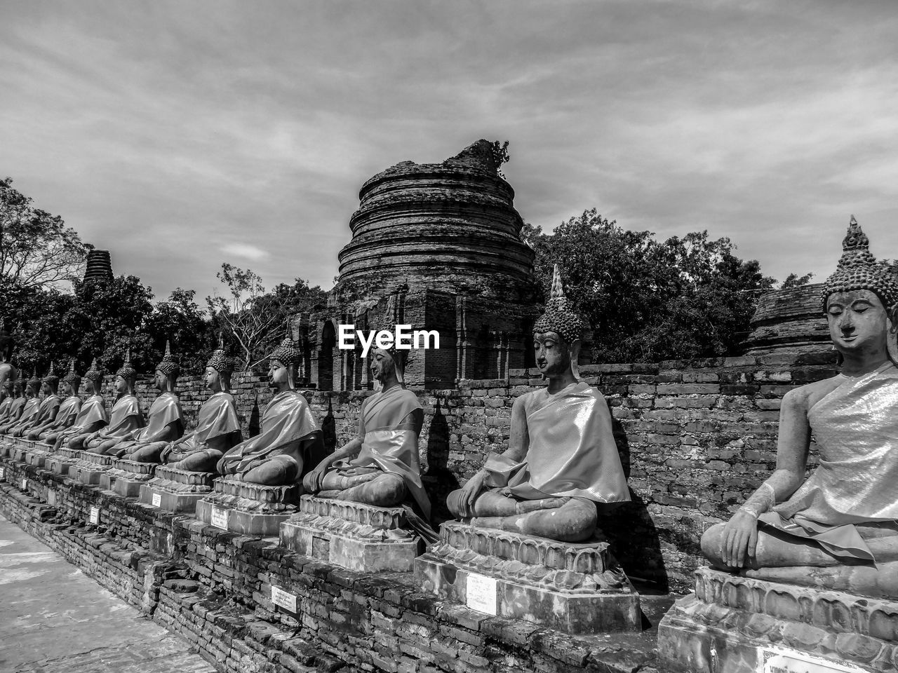 STATUE AGAINST TEMPLE