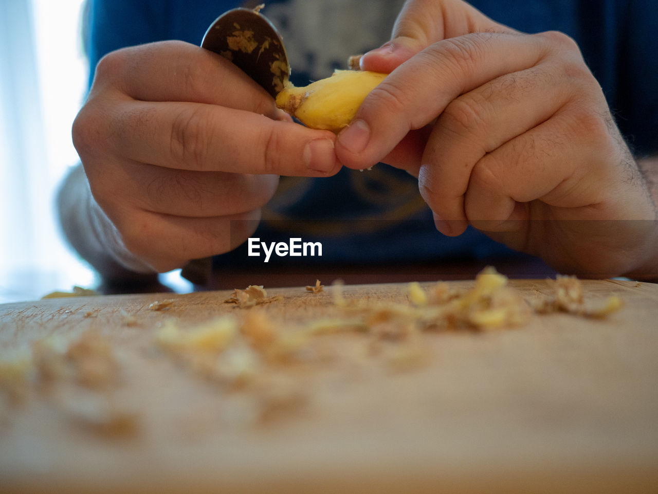 Midsection of person preparing food on table