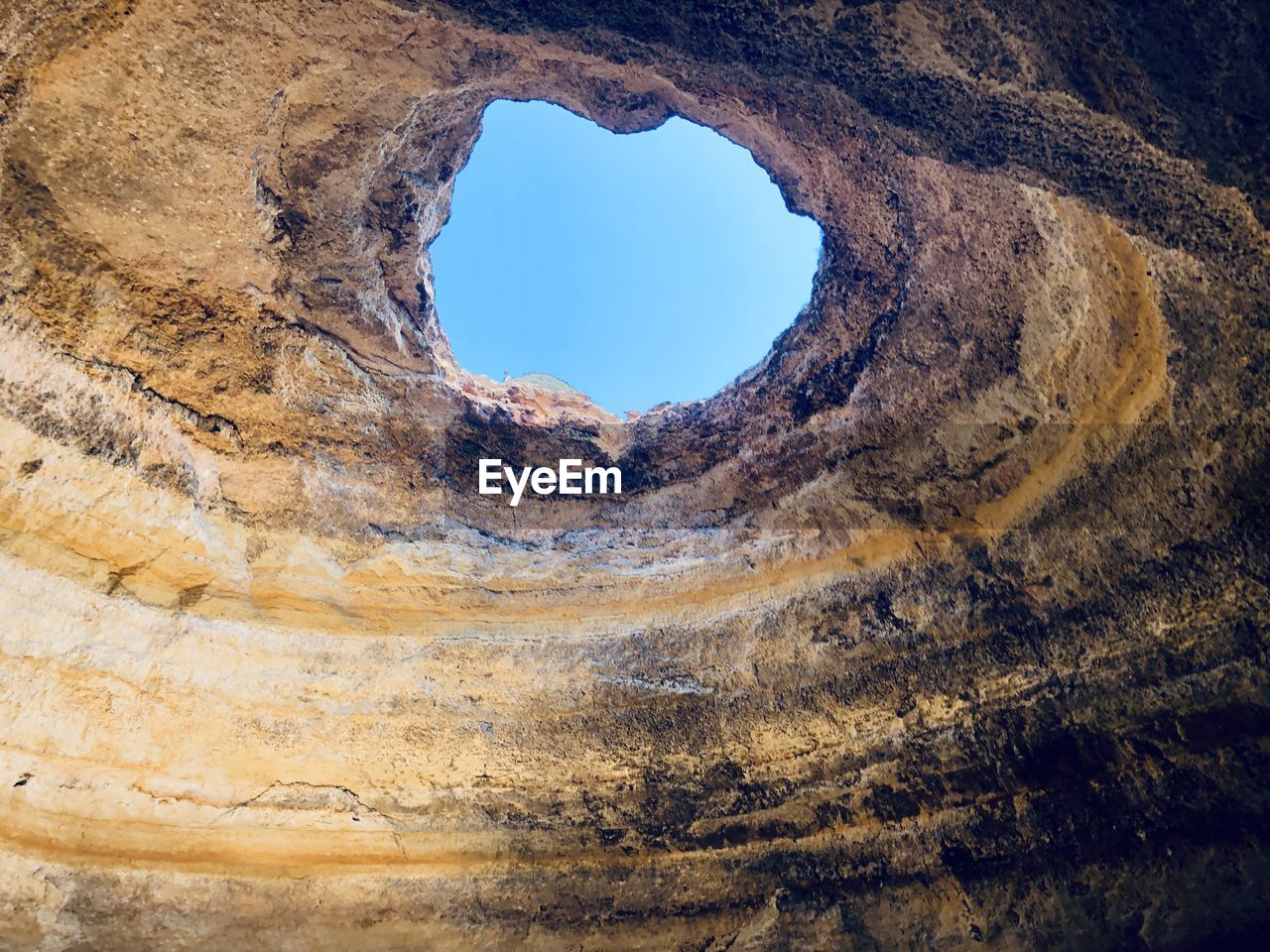 Low angle view of rock formation against sky