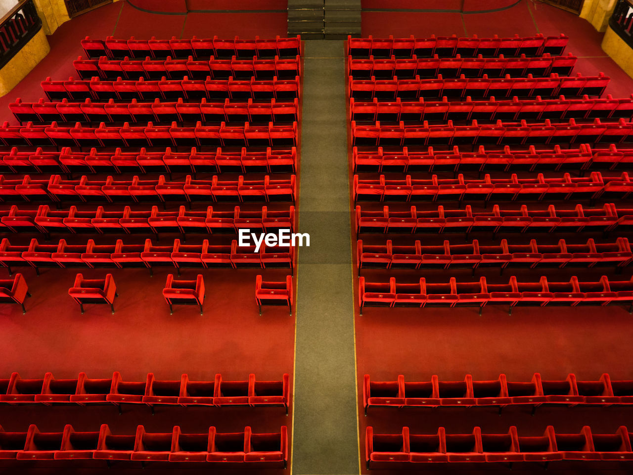 The red armchairs of a theater