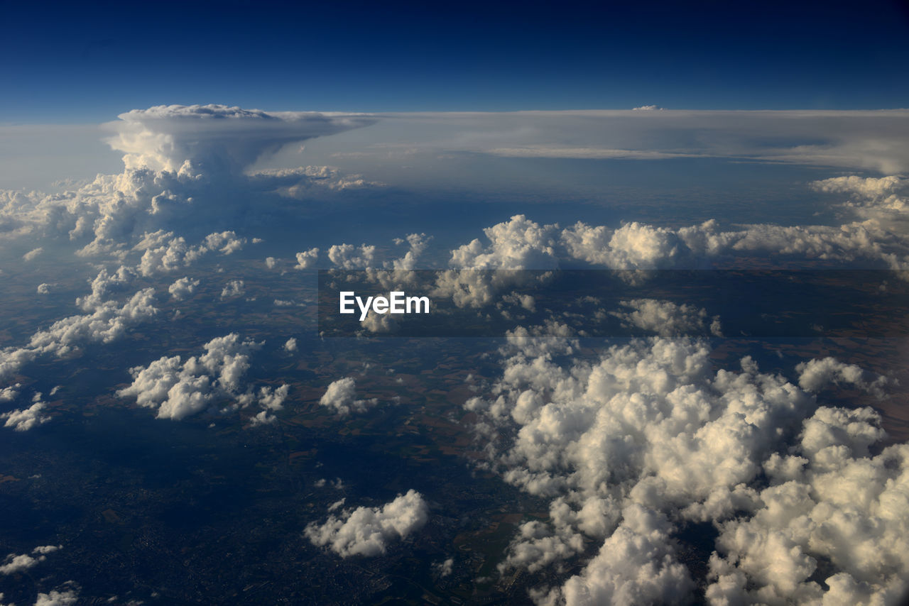 AERIAL VIEW OF CLOUDS OVER BLUE SKY