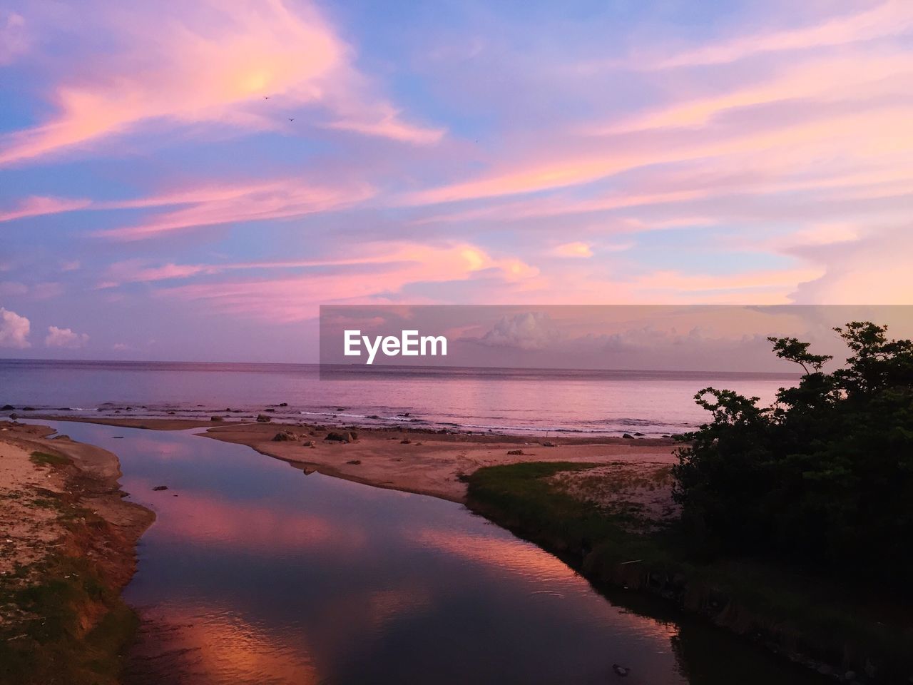 Scenic view of sea against sky at sunset