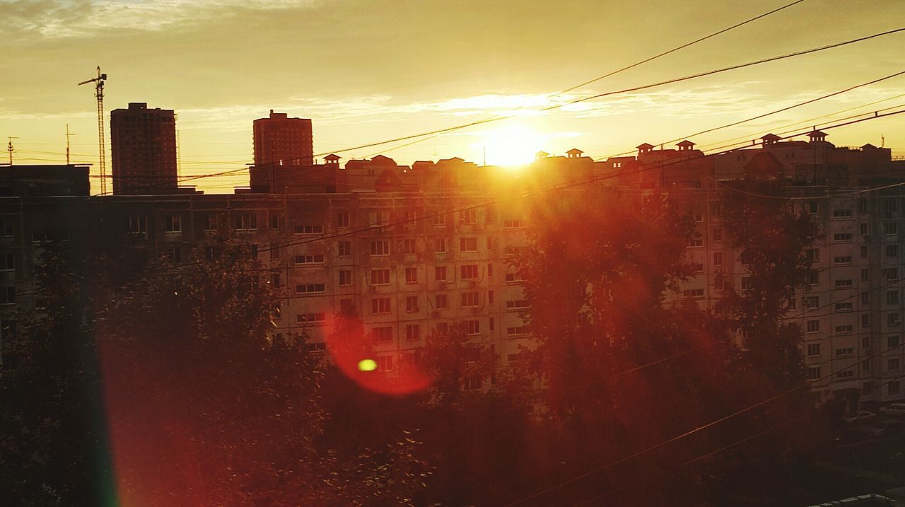 VIEW OF CITYSCAPE AT SUNSET