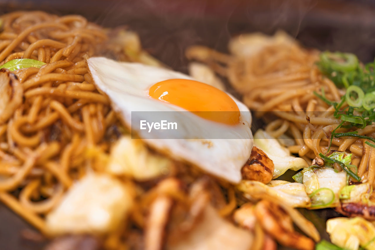 Close-up on yakisoba japanese noodles cooked on a hot plate