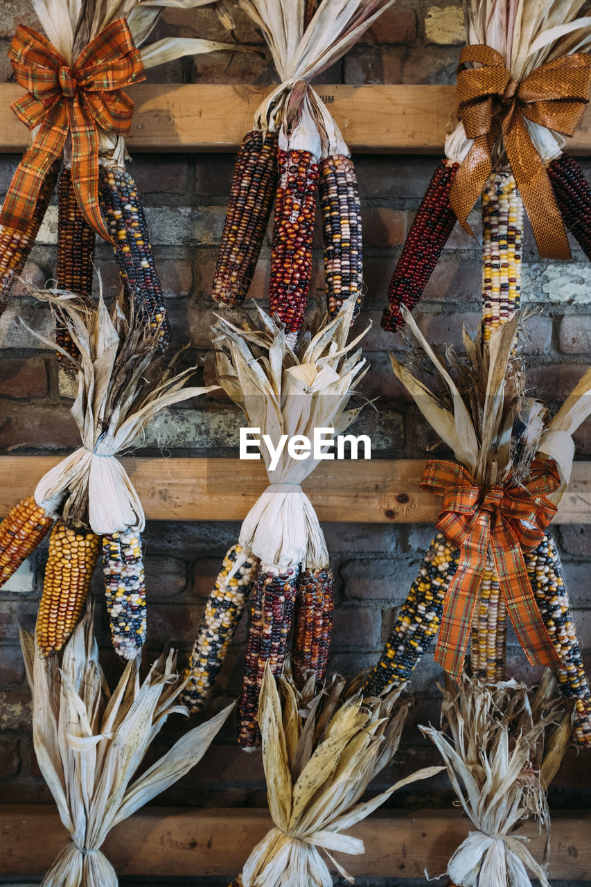 CLOSE-UP OF DECORATIONS HANGING IN MARKET