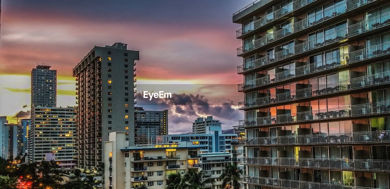 BUILDINGS AGAINST SKY DURING SUNSET