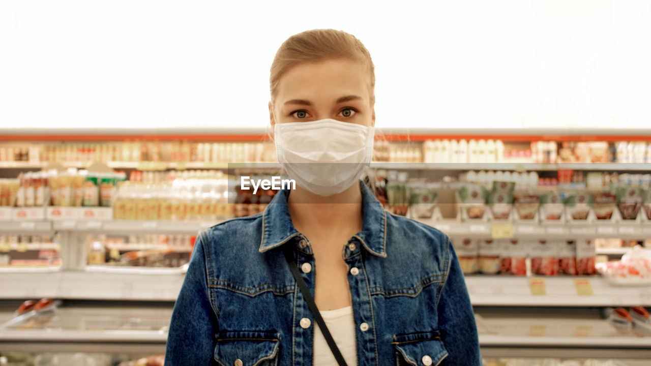 Woman in a protective mask in a store