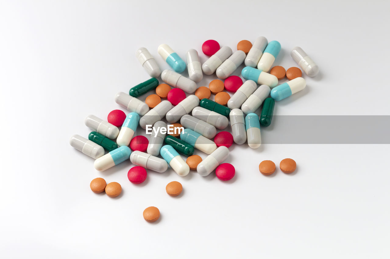 pill, dose, medicine, capsule, healthcare and medicine, large group of objects, pharmacy, drug, pharmaceutical drug, nutritional supplement, variation, prescription medicine, studio shot, multi colored, vitamin, medical, white background, indoors, no people, abundance, solution, antibiotic, science, cut out, care, heap, still life, medical supplies, excess, close-up, narcotic, recovery, illness