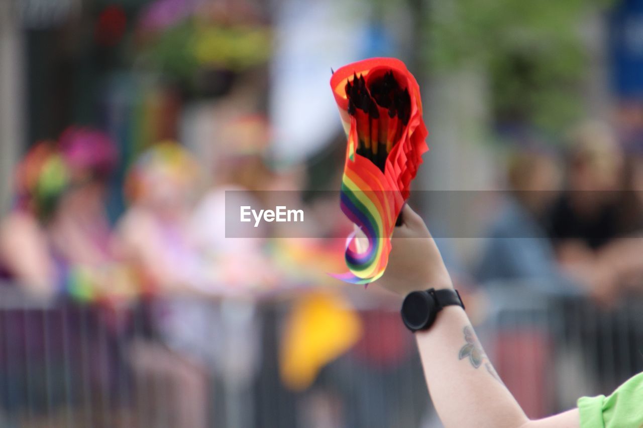 CLOSE-UP OF PERSON HAND HOLDING TOY