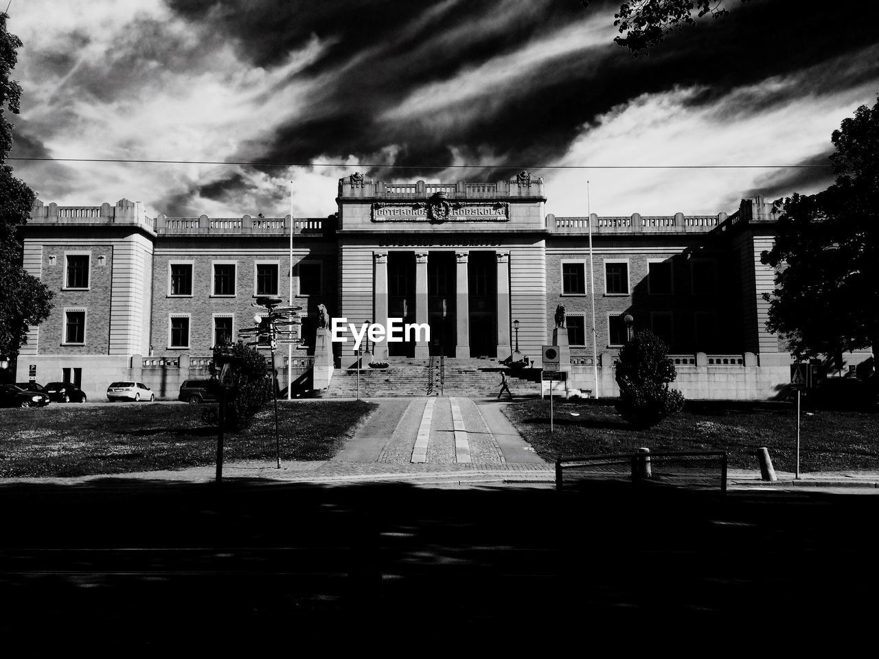 Exterior of university of gothenburg building against cloudy sky