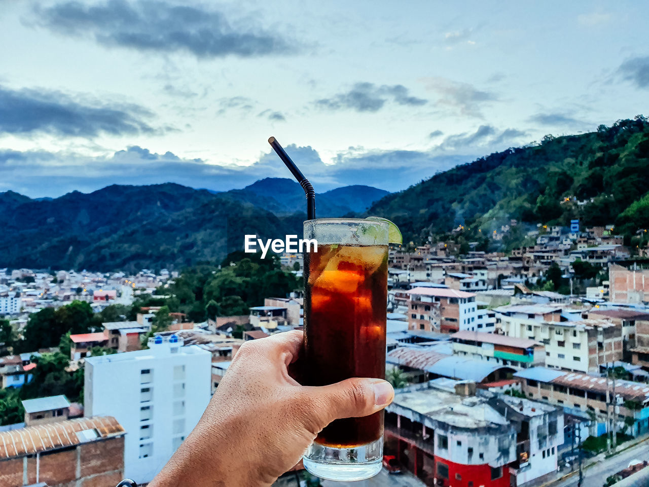 cropped hand of woman holding drink