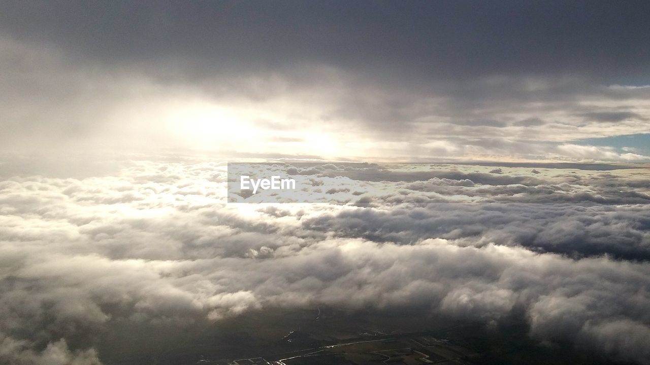 Aerial view of cloudscape over field