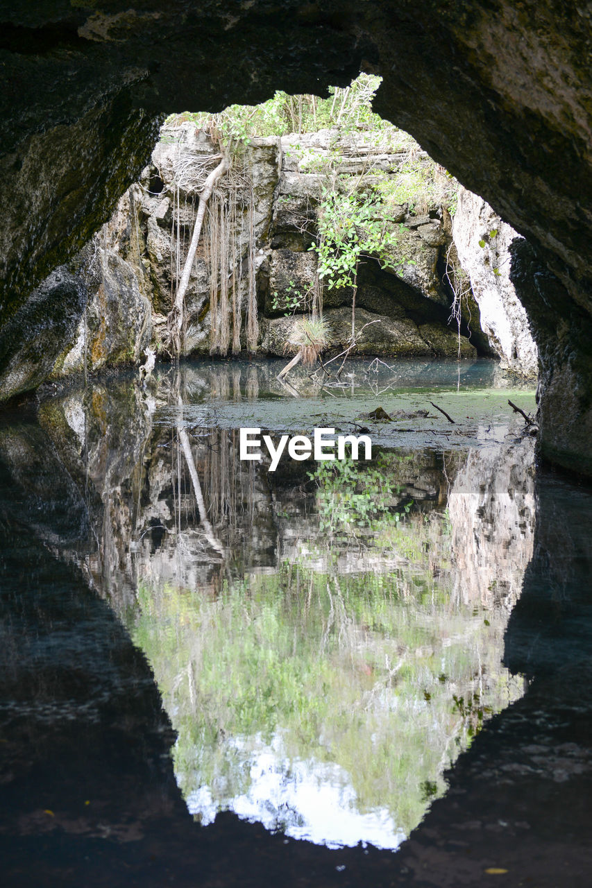 CLOSE-UP OF WATER FLOWING OVER ROCKS