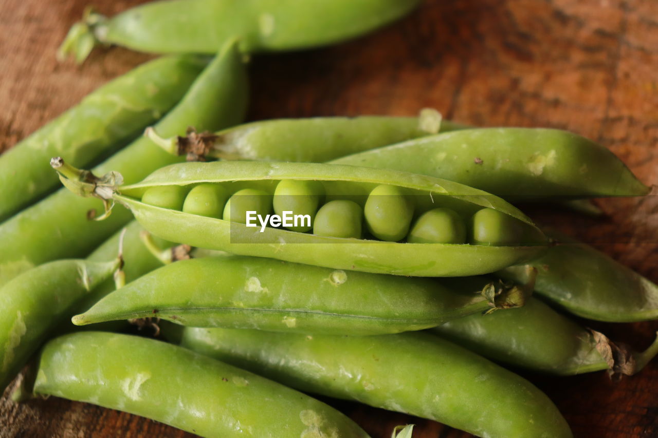 High angle view of green chili peppers on table