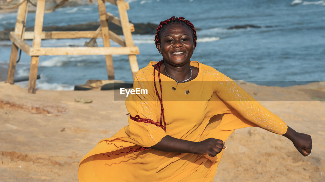 Happy africa ghana woman on the beach in accra