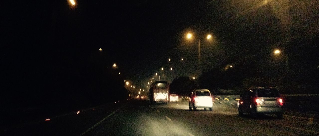 CARS ON ROAD AT NIGHT