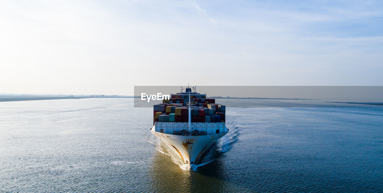 VIEW OF SHIP IN SEA AGAINST SKY