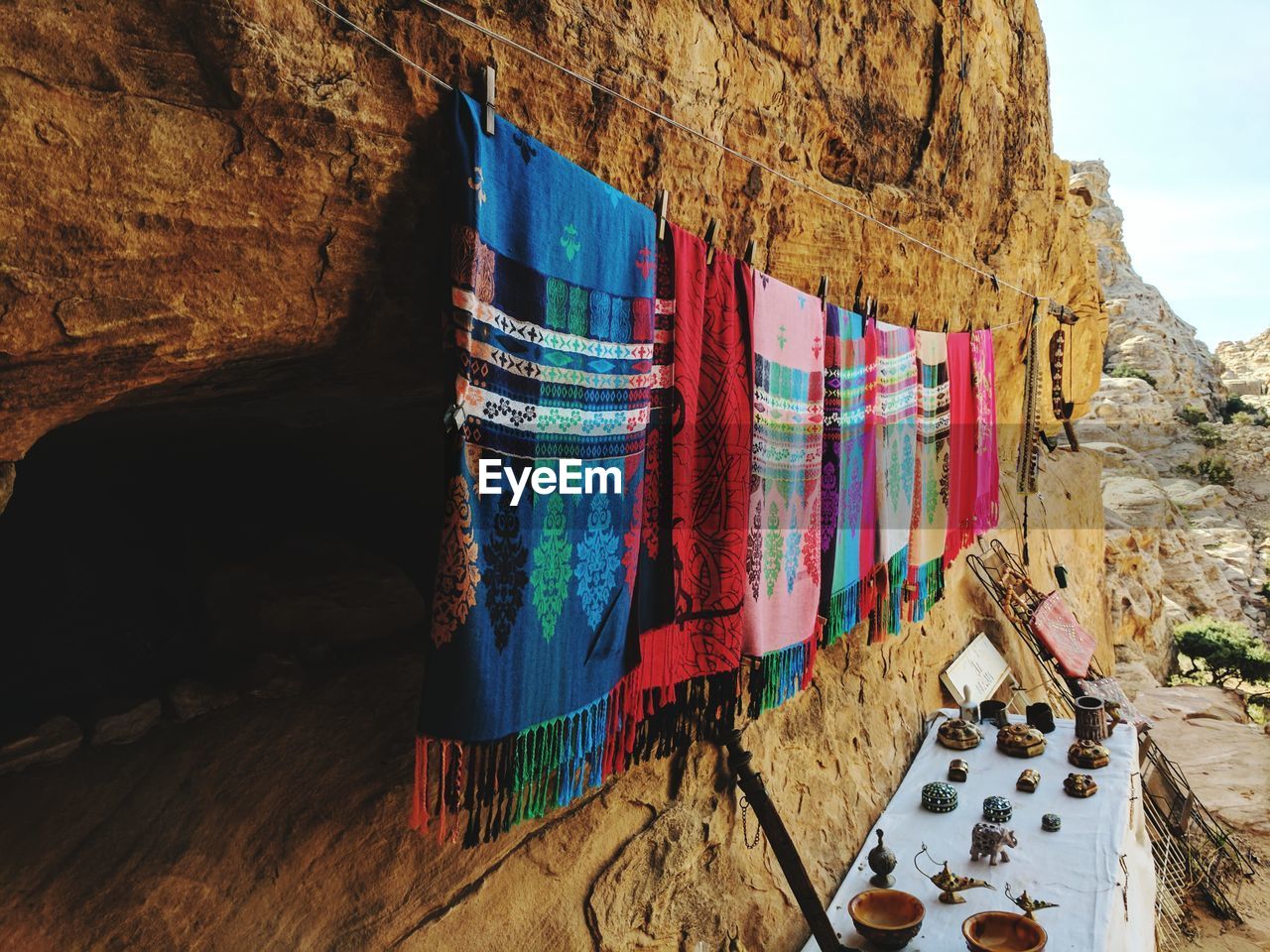 MULTI COLORED CLOTHES DRYING ON ROCK