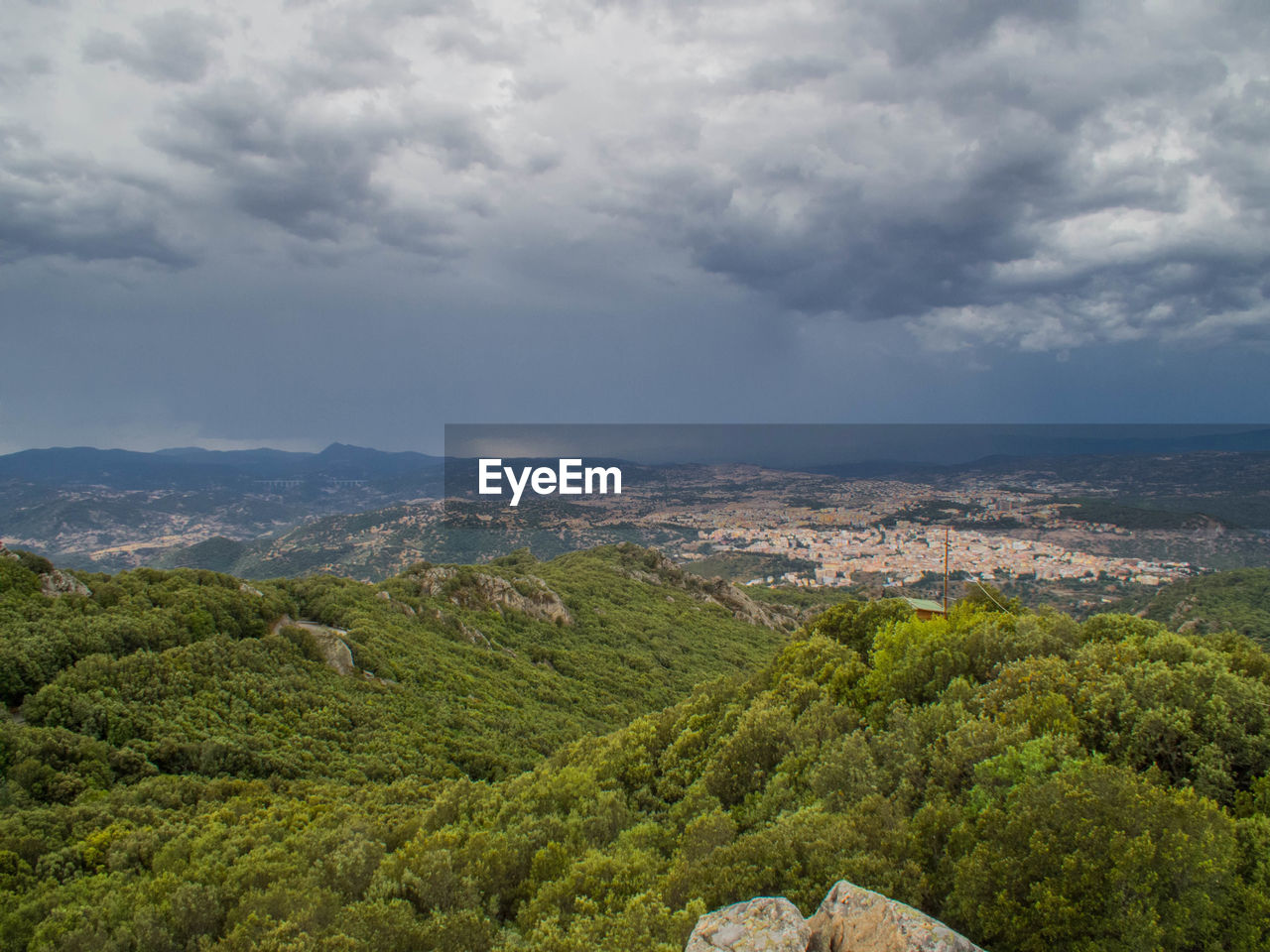 Scenic view of landscape against cloudy sky