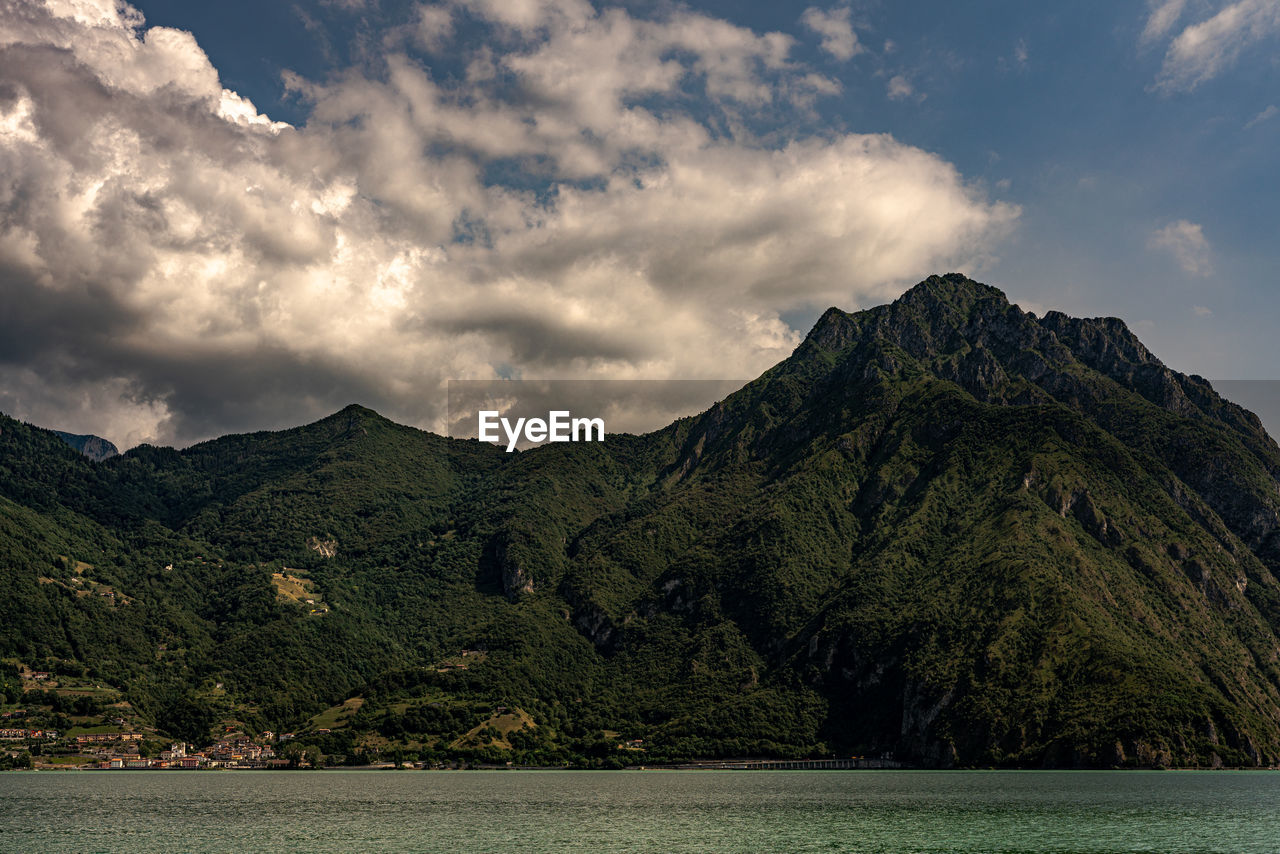 Scenic view of mountains and sea against sky