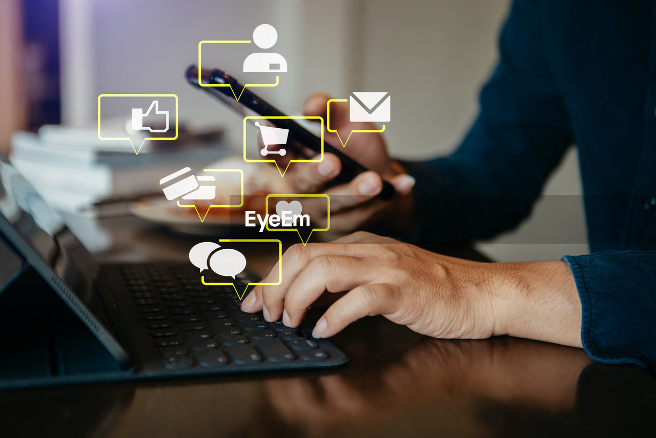 Midsection of man using laptop