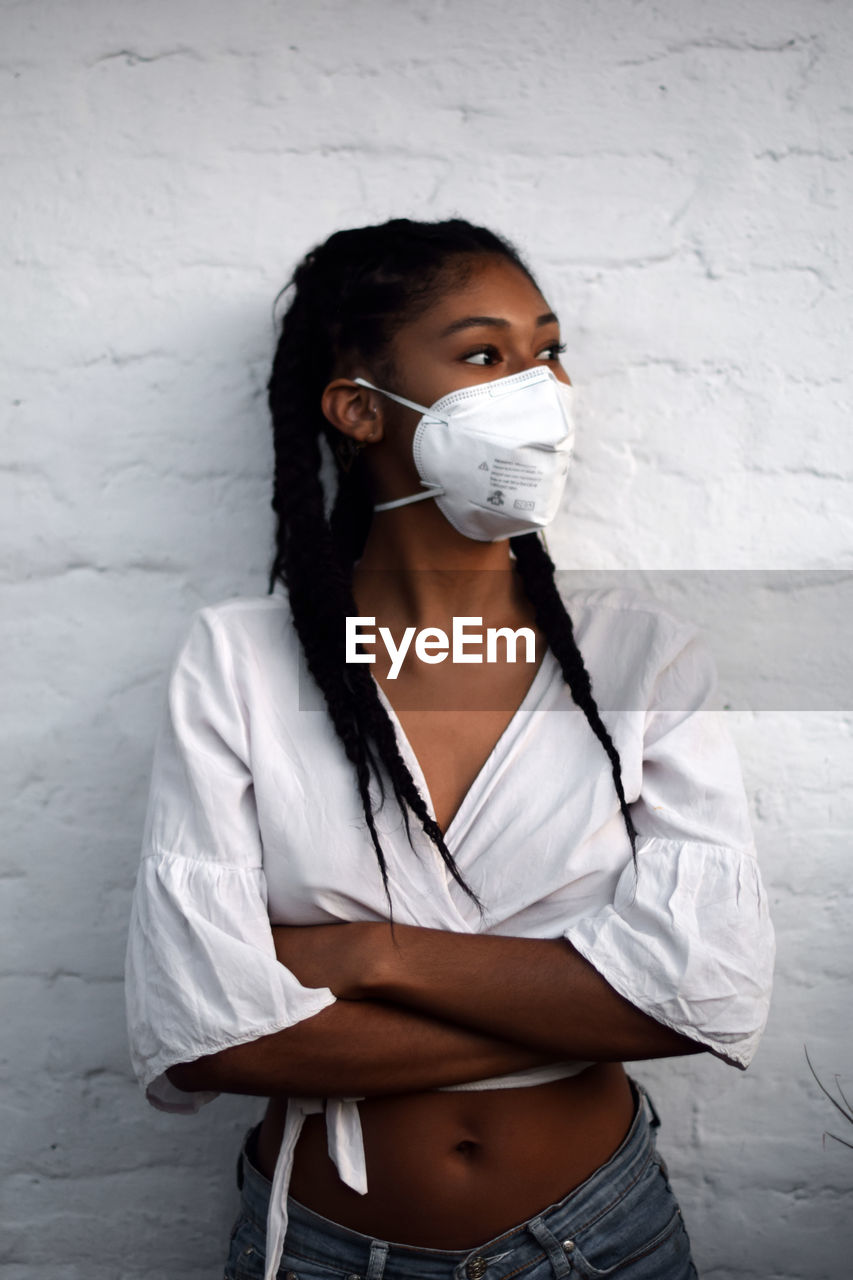 Young black woman in face mask