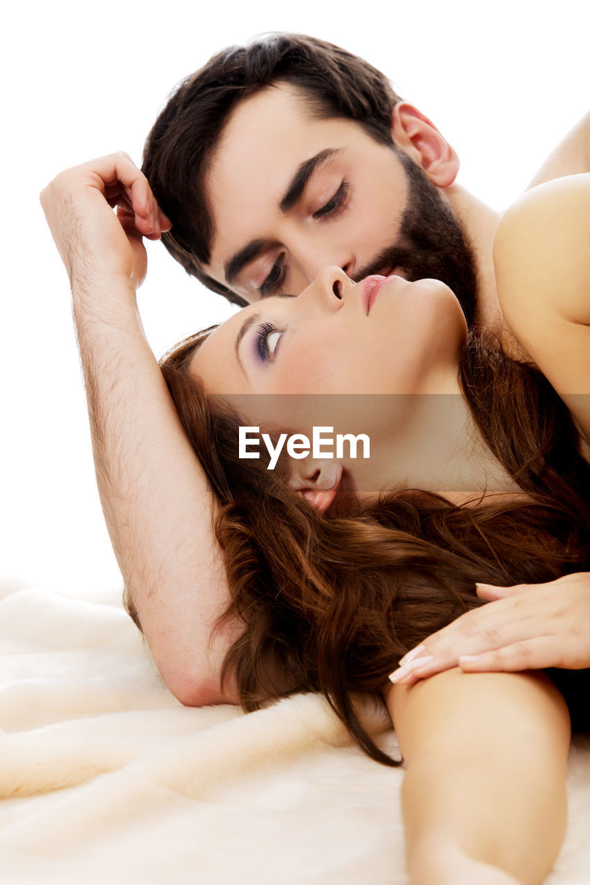High angle view of romantic couple on bed