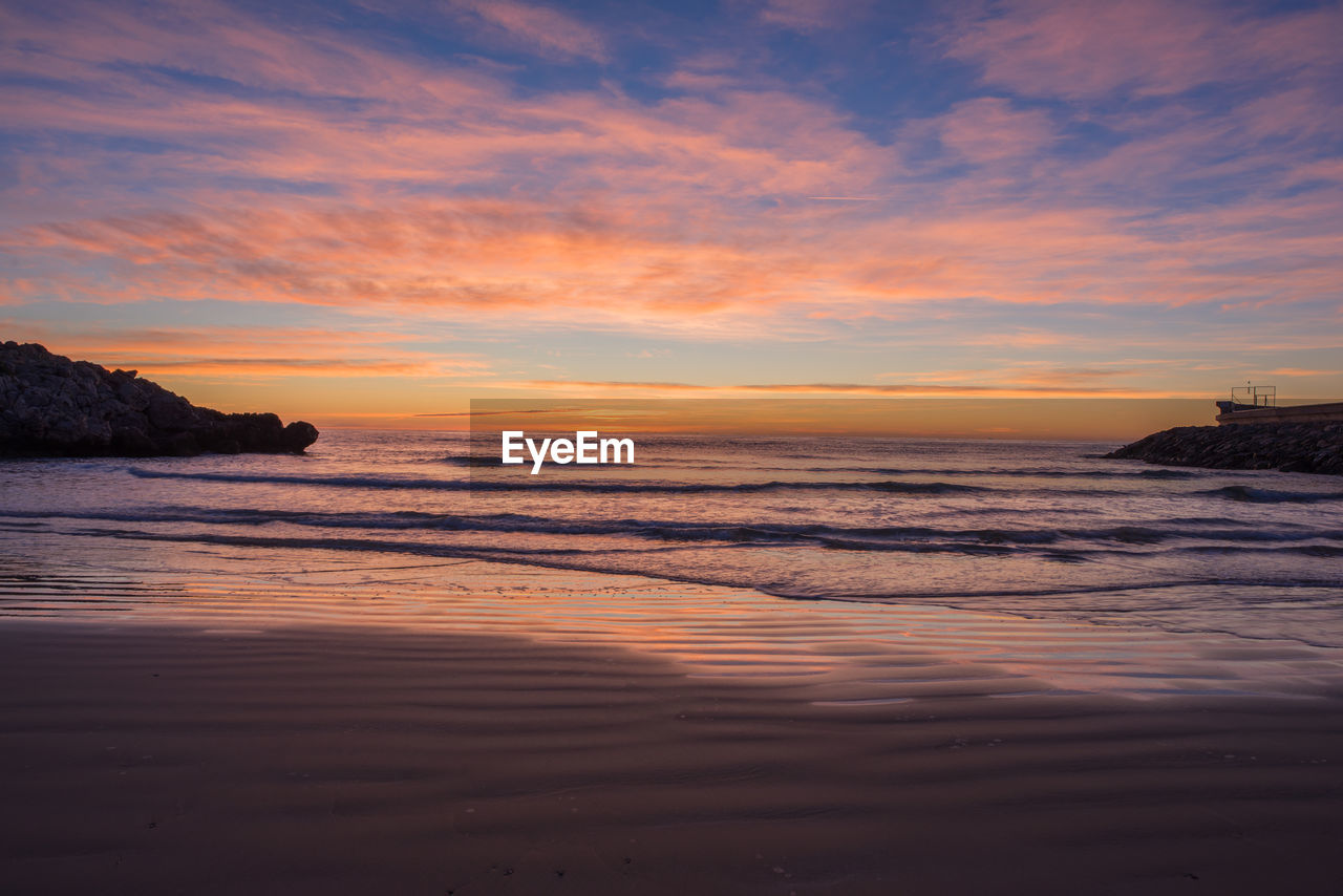 Scenic view of sea against sky at sunset