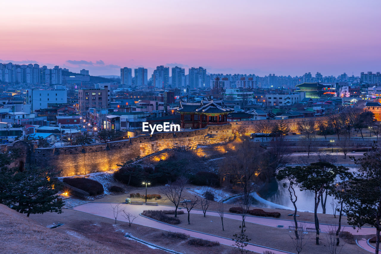 High angle view of cityscape against sky at sunset