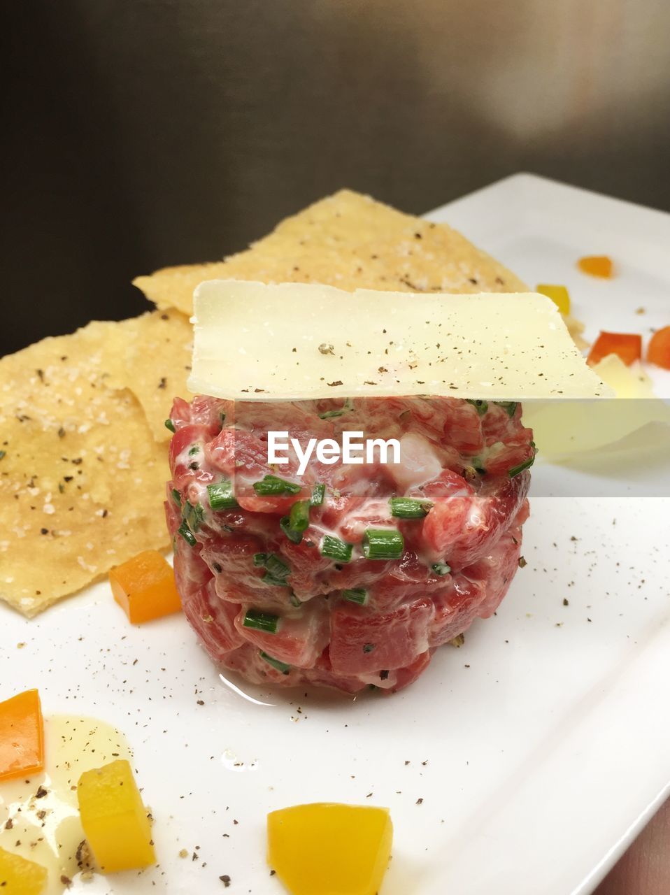 Fresh beef tartare with parmesan and crackers