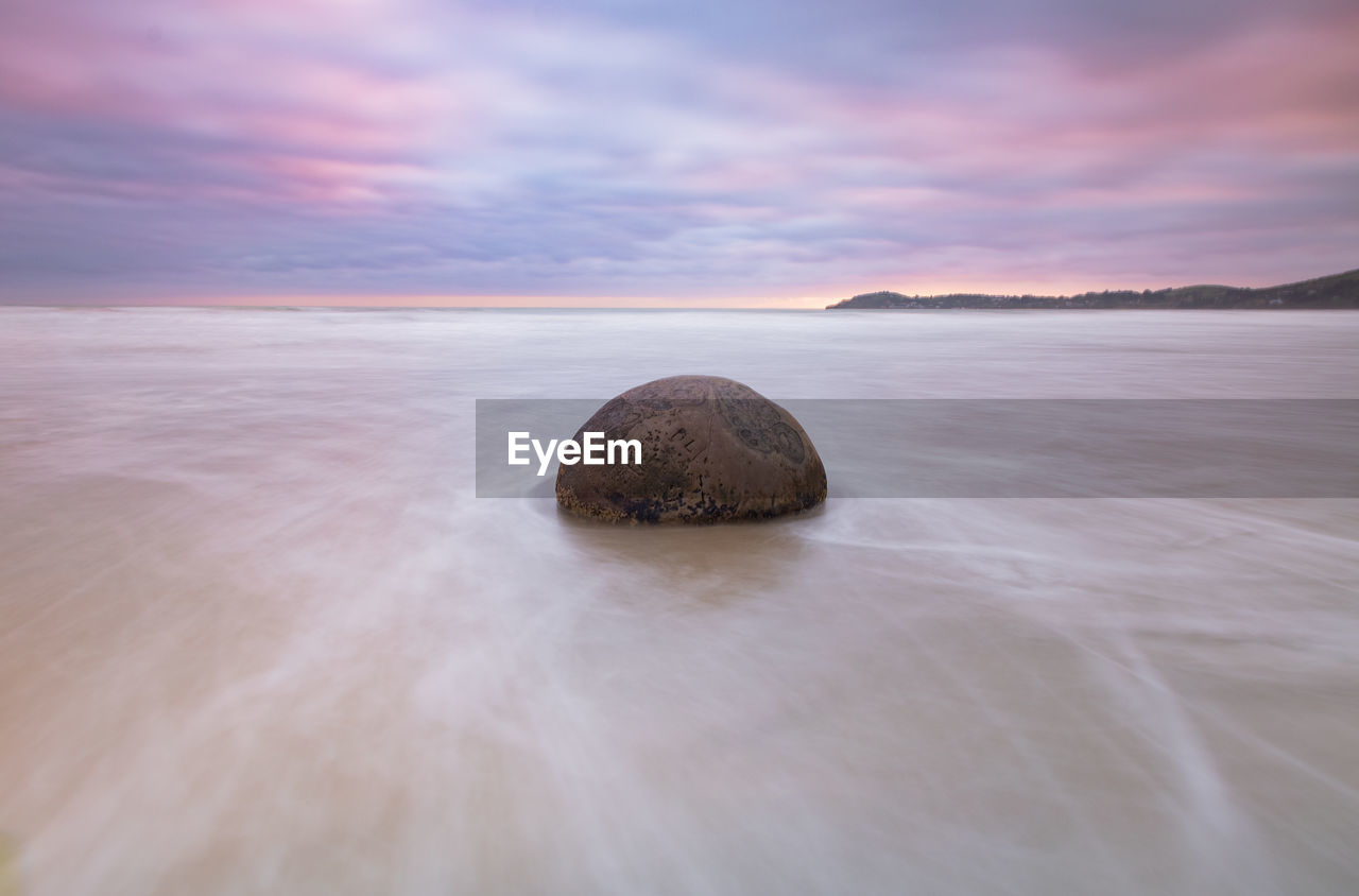 scenic view of sea against sky at sunset