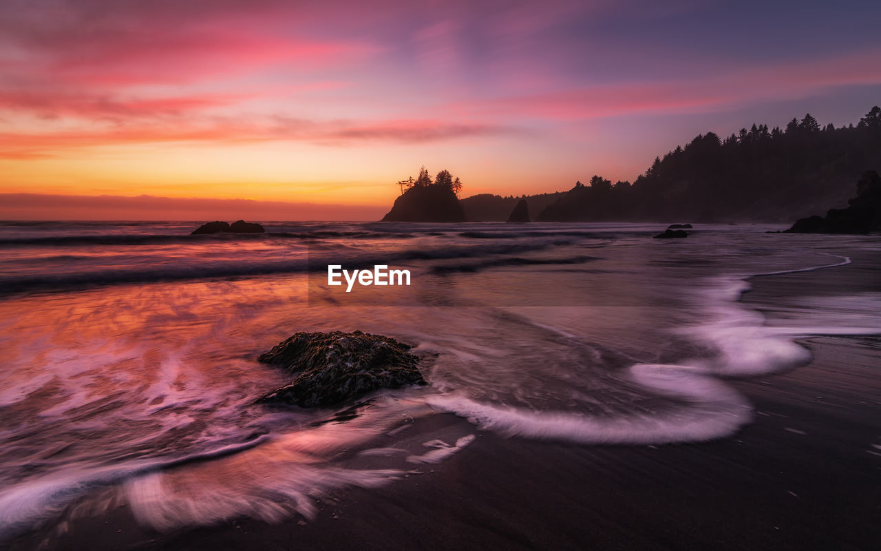 Scenic view of sea against sky during sunset