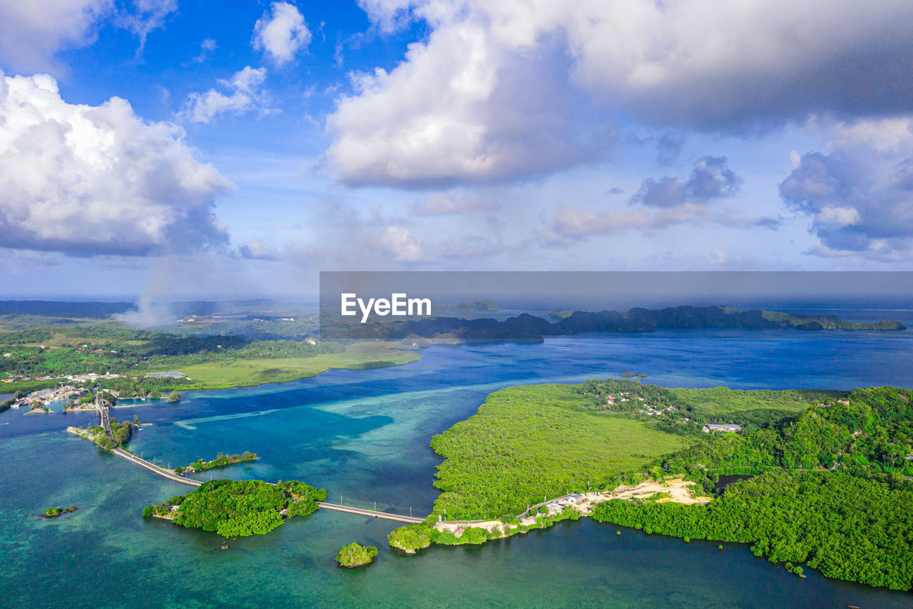 High angle view of island against cloudy sky